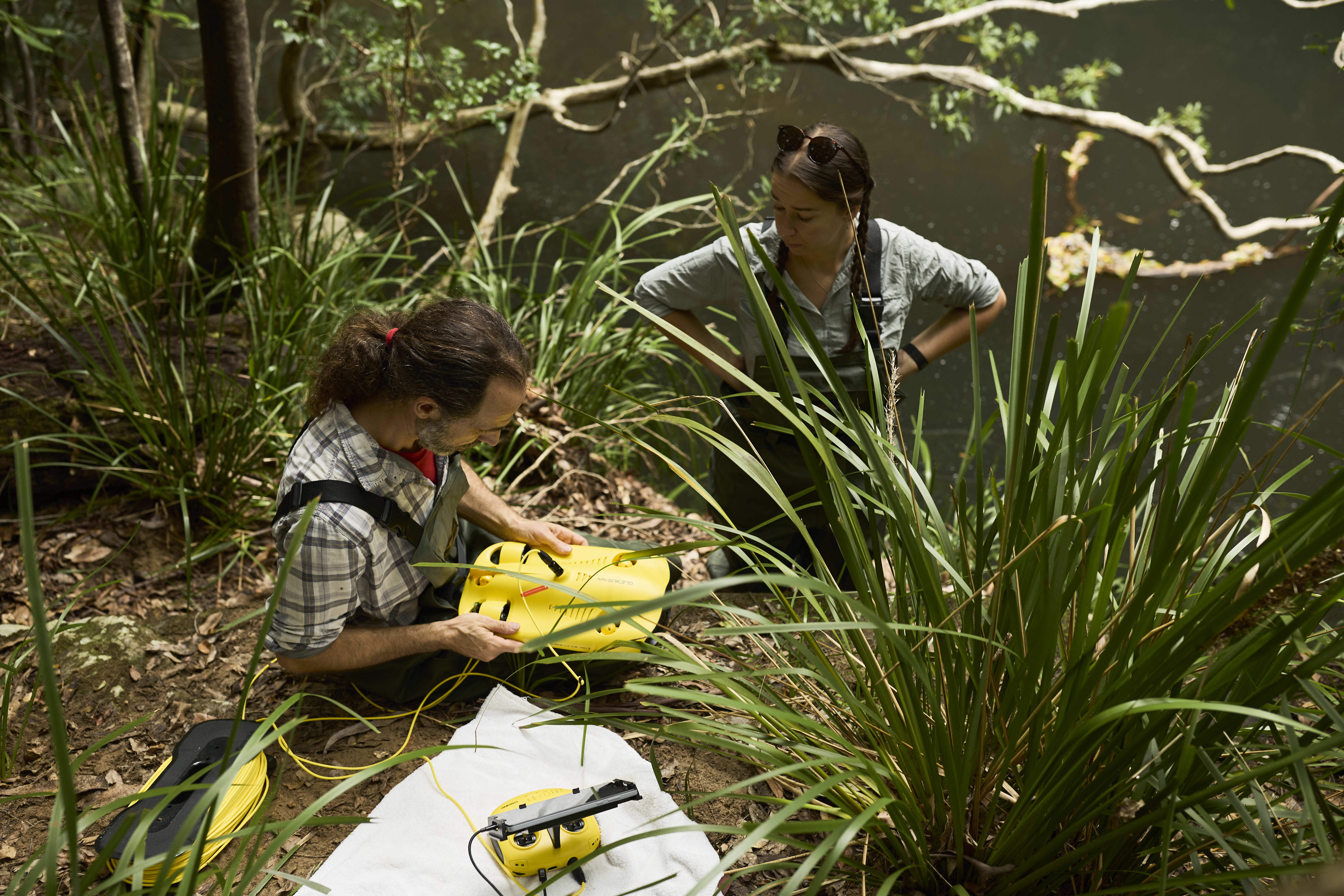 Drs Gilad Bino and Tahneal Hawke checking acoustic trackers for signs of platypus activity