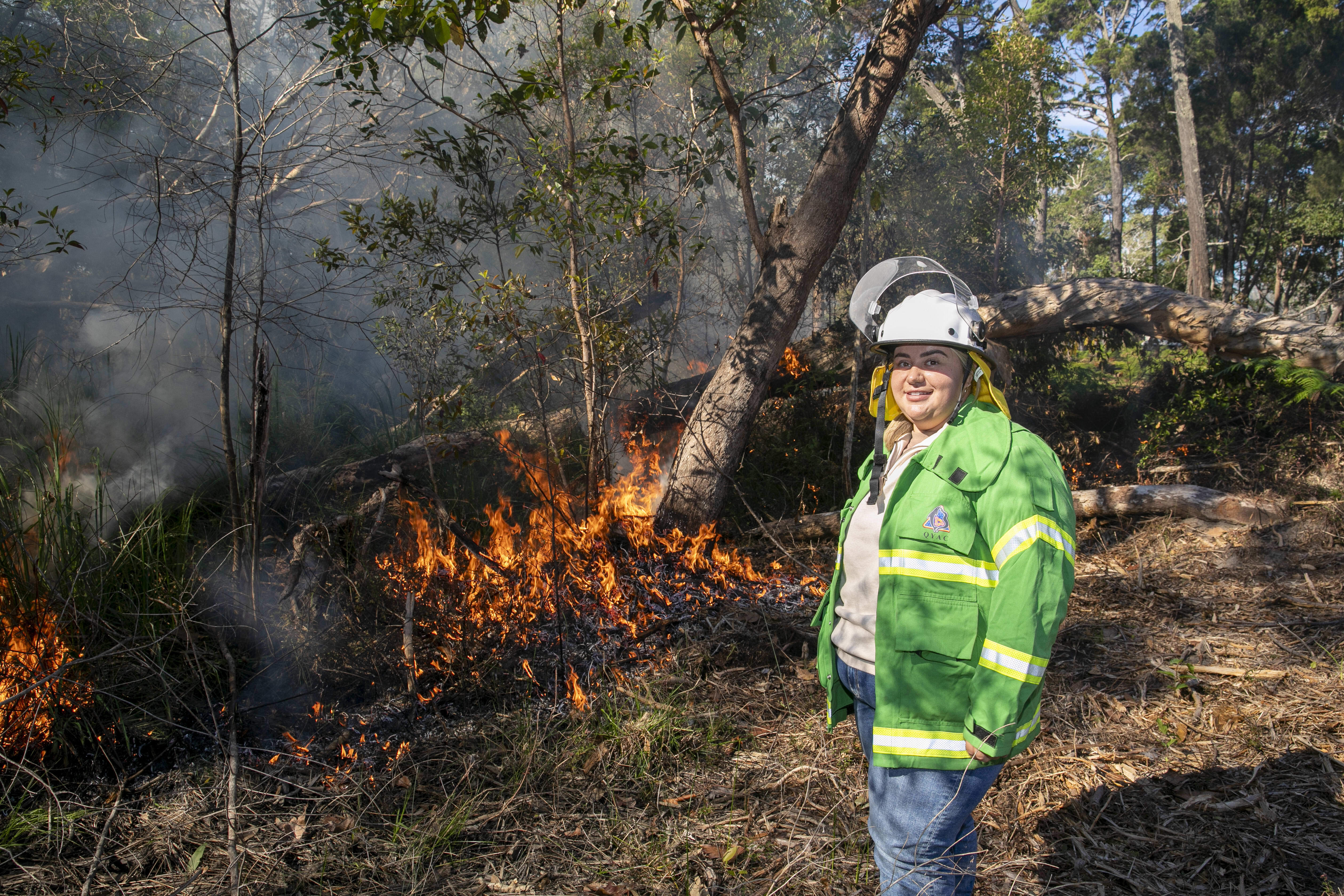 Quandamooka Yoolooburrabee Aboriginal Corporation (QYAC)'s Kiah Morgan at a Cultural burn on Minjerribah (North Stradbroke Island)