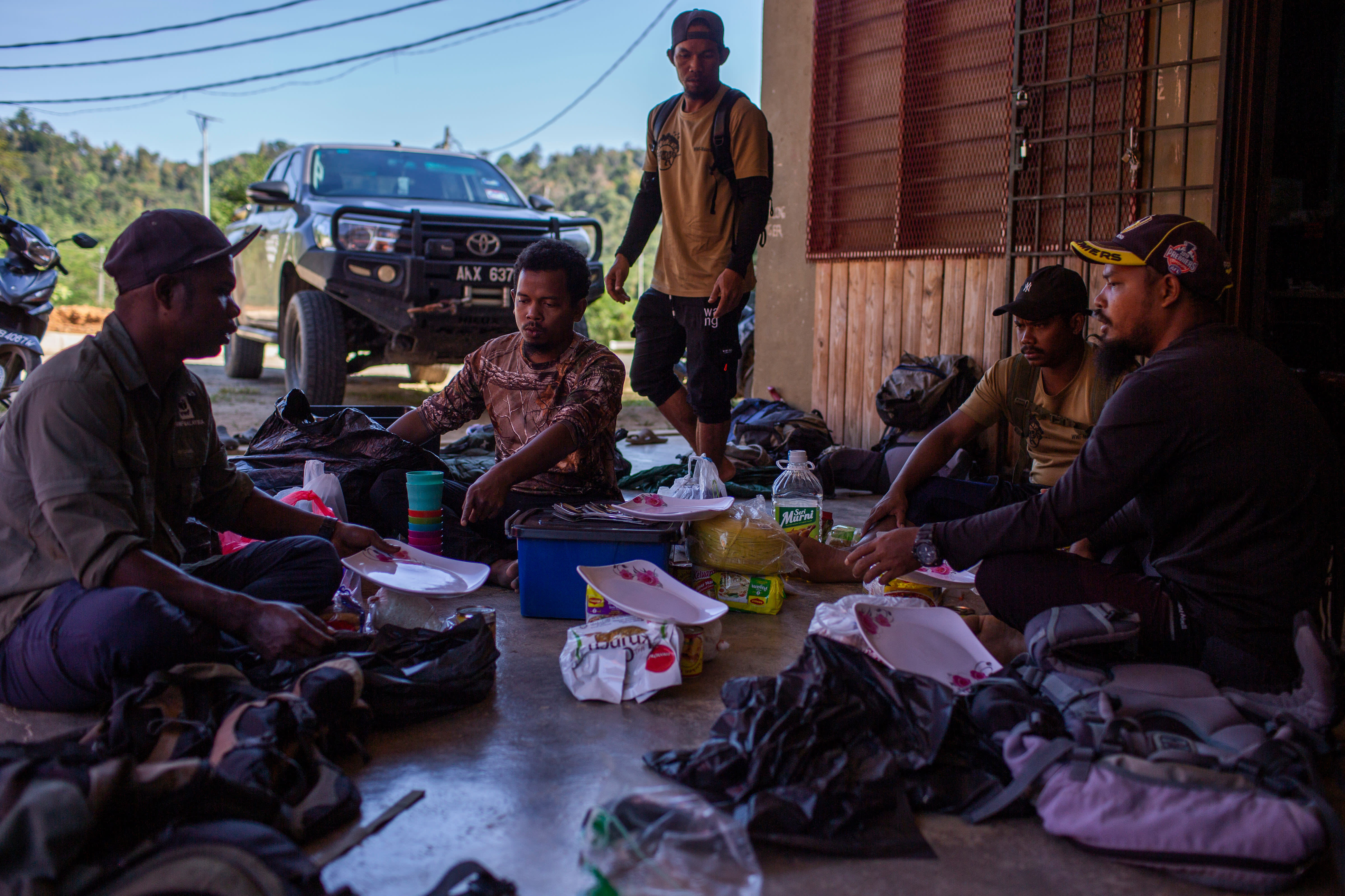An anti-poaching patrol team gets ready to enter the forest of Royal Belum State Park for several days, Malaysia.