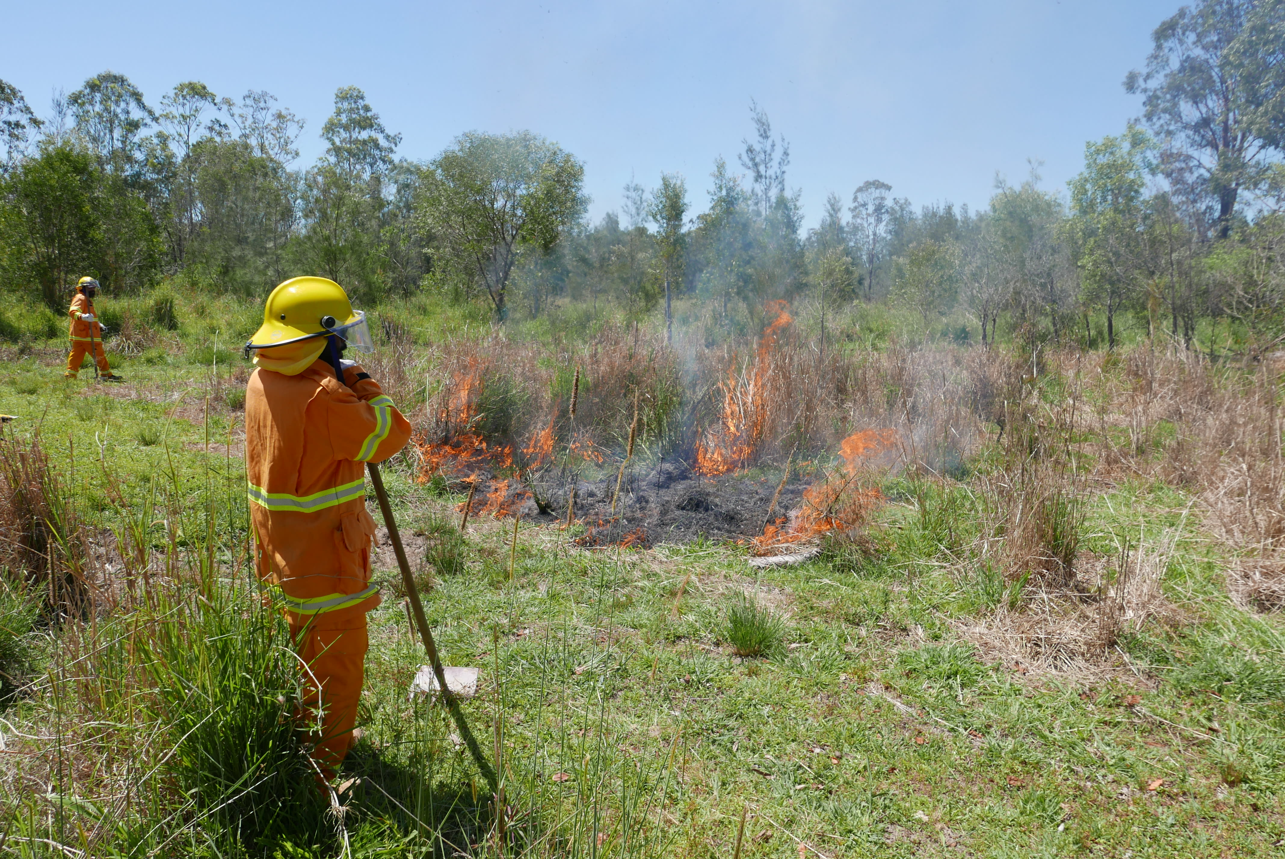 A ranger monitors a cultural burn on the Minyumai IPA