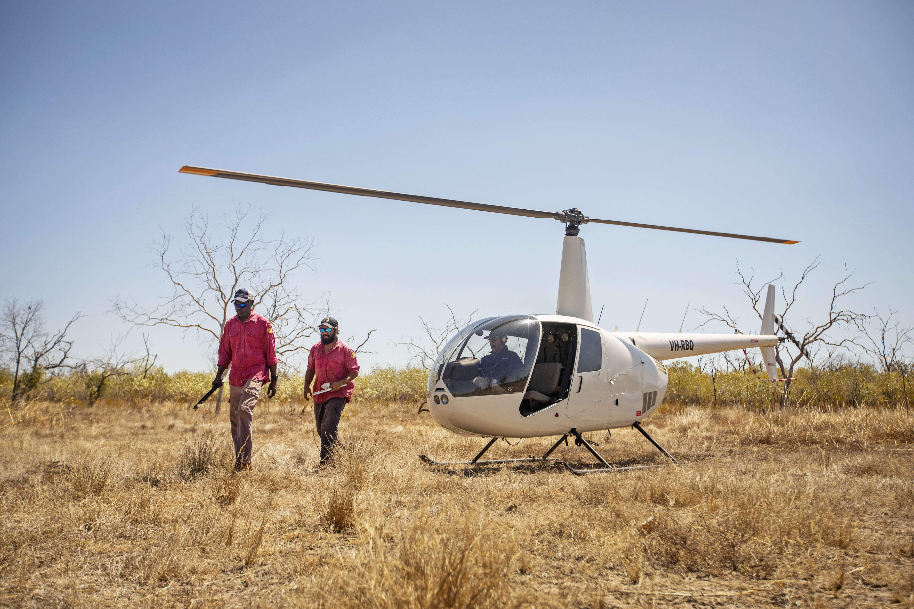 Nyaliga Rangers arrive by helicopter on Wilinggin Country (Left to right: Nyaliga Rangers Clayton Victor and Silas Purcell.