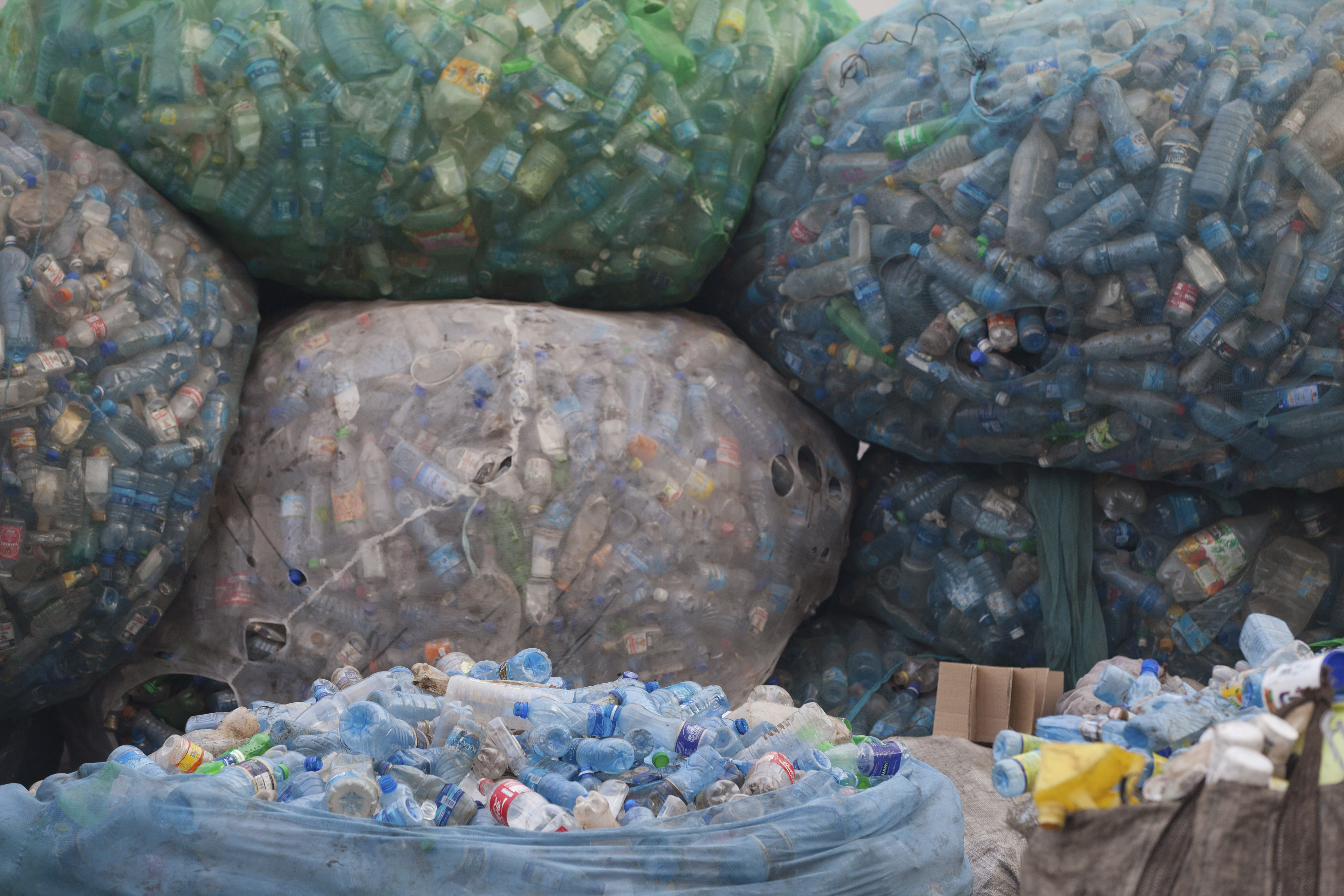 Bags of plastic bottles at a recycling station, Kisumu, Kenya