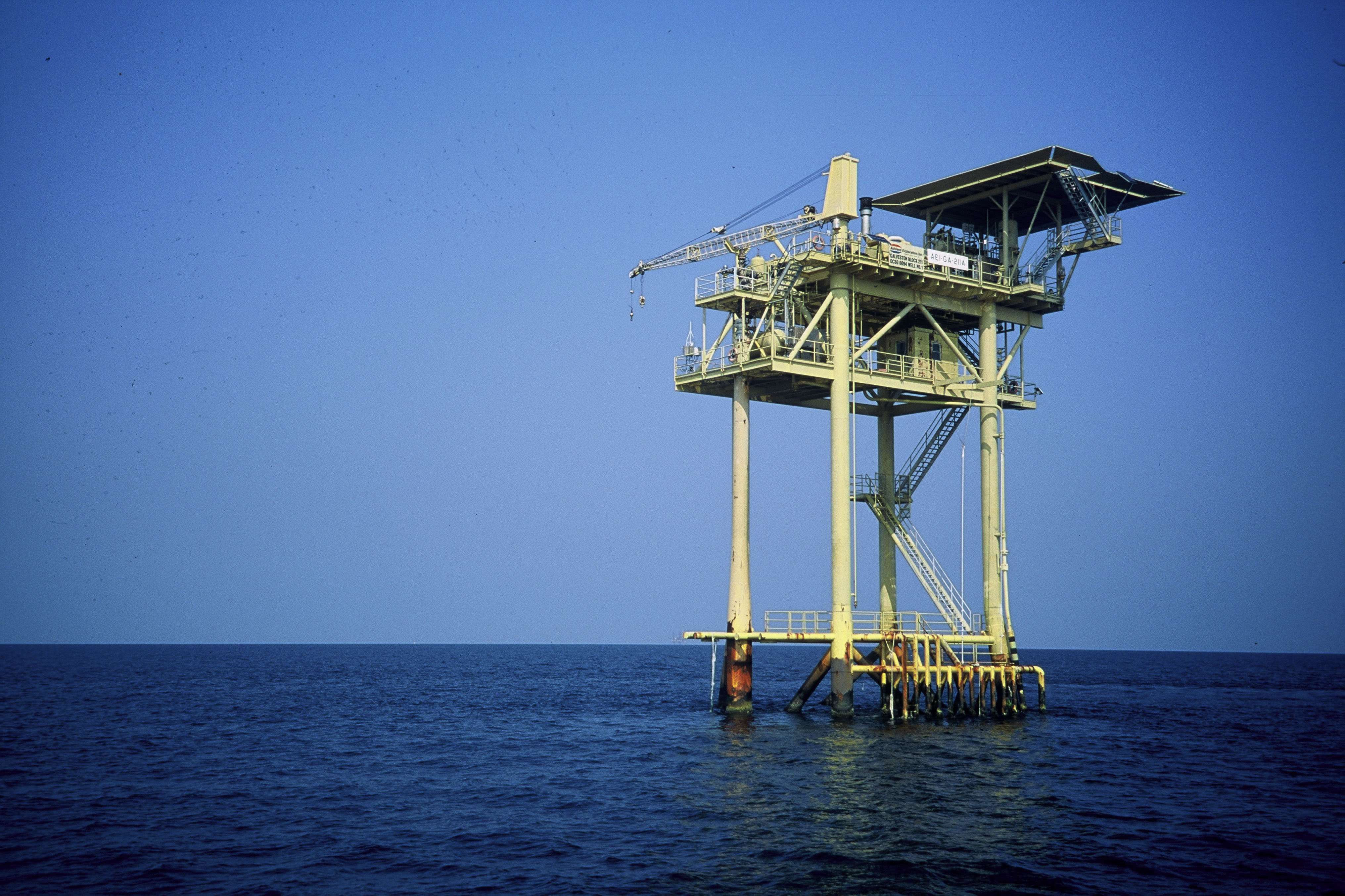 Oil riggs. Offshore oil and gas development, one of many threats to marine life. Texas, Gulf of Mexico, USA