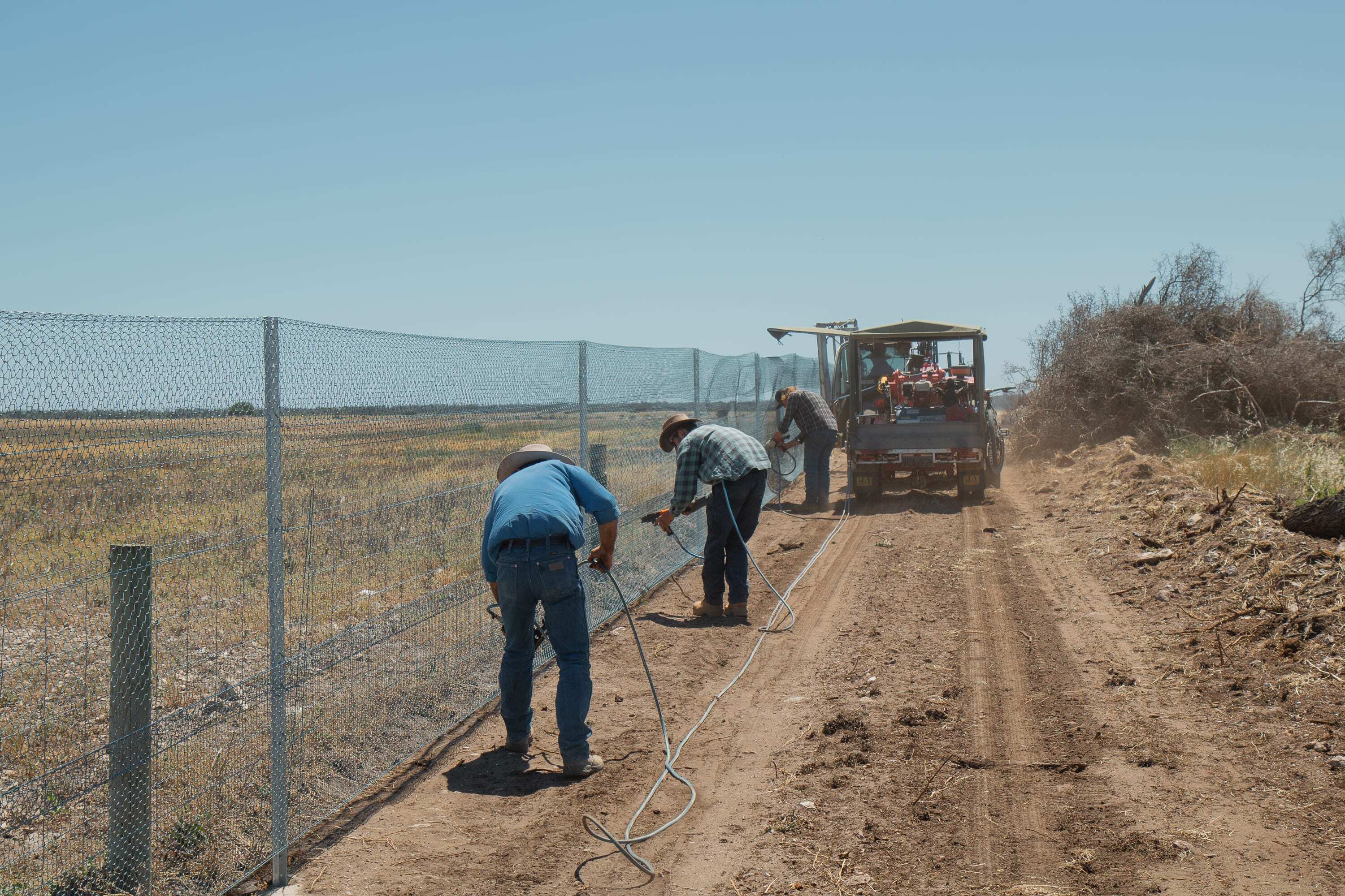 Contractors building the predator control fence on the Yorke Peninsula in South Australia as part of the Great Southern Ark project