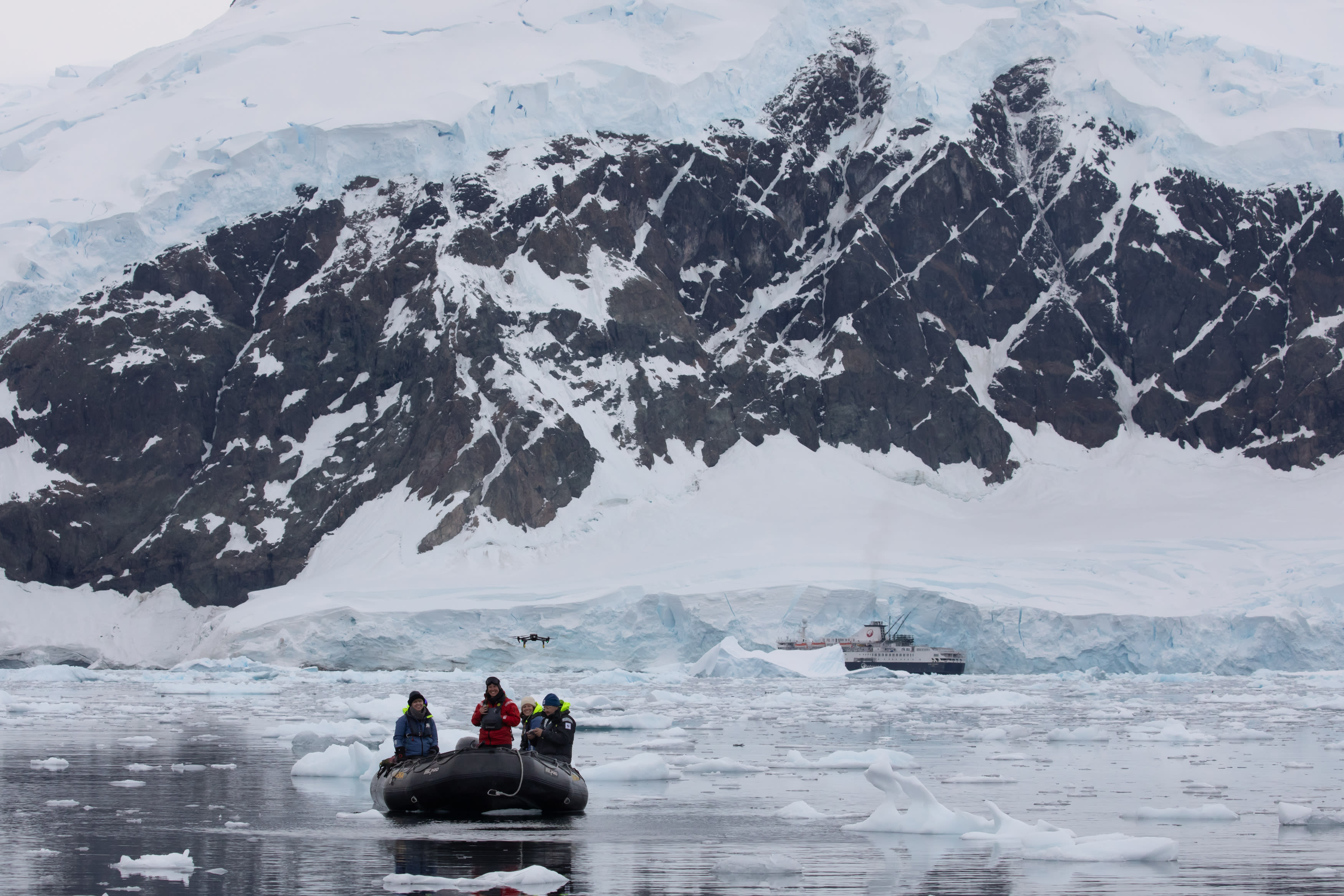 WWF's Chris Johnson flying a drone from a zodiac in waters of the Antarctic Peninsula in March 2024.