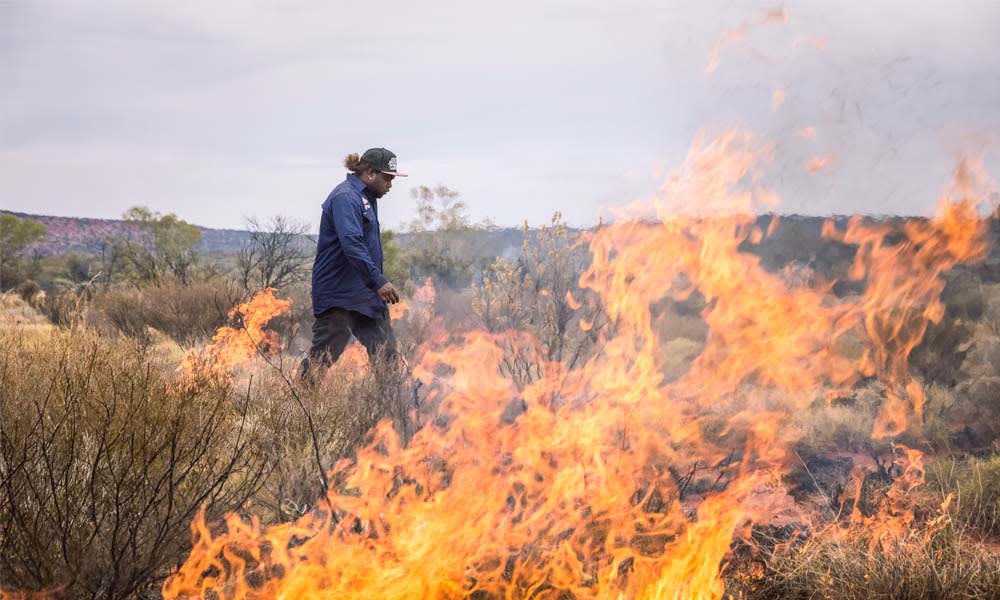 Zareth Long undertaking controlled burn in Birriliburu Indigenous Protected Area= WA. Annette Ruzicka= Bush Heritage Australia= Author provided