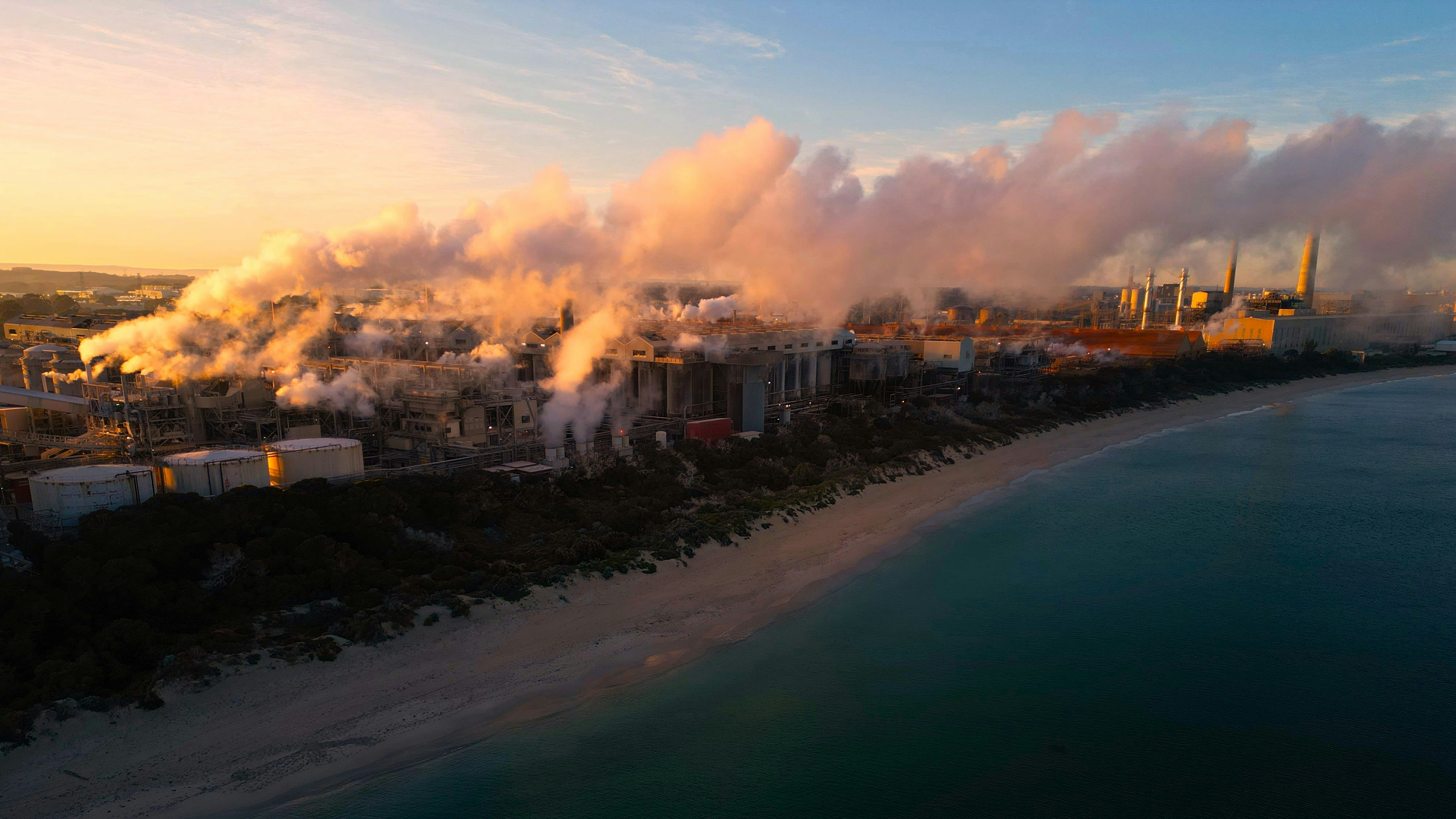 Aerial view of smoke rising from a coal-fired powerplant