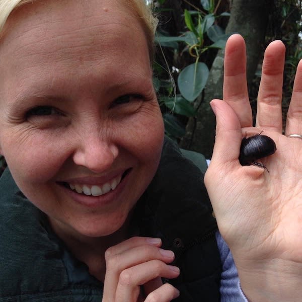 WWF-Australia Chief Conservation Officer Rachel Lowry holding an endangered Lord Howe Island Wood Feeding Cockroach