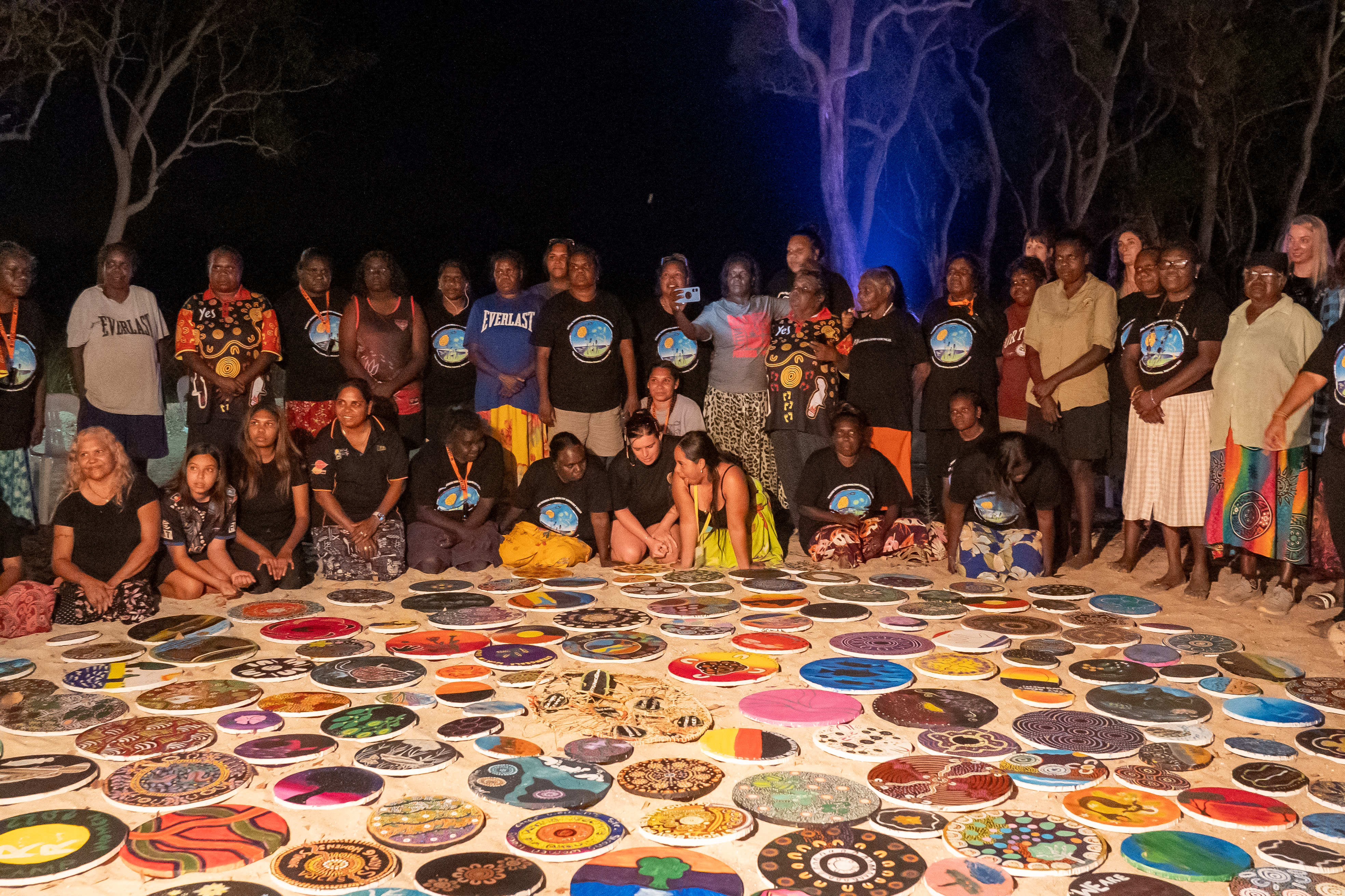 Participants showcasing their artwork at the 2023 Strong Women for Healthy Country Forum