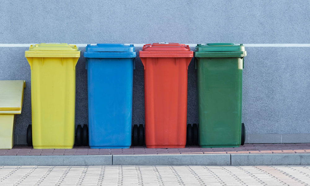 Colourful recycling bins. Photo by Paweł Czerwiński on Unsplash