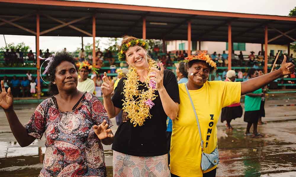 Gilly Llewellyn WWF-Australia conservation director dancing at the end of the Women’s Saving Club launching celebration= Solomon Islands= 2015