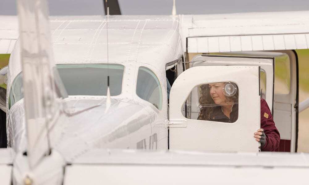 Dr Liberty Olds, Conservation Manager, Zoos SA unloading cargo from charter plane