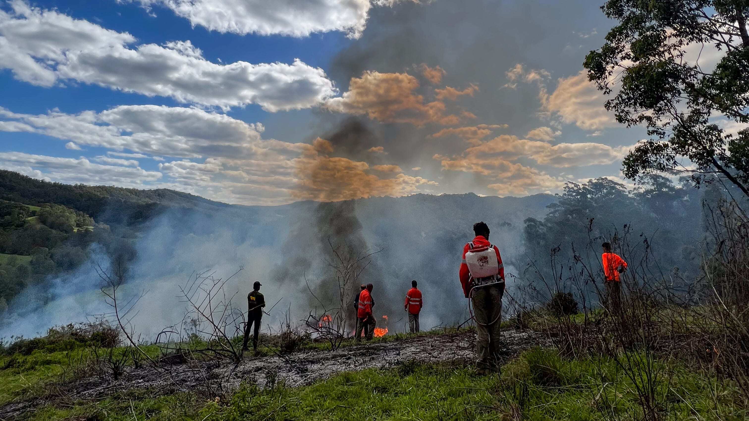 Githabul Rangers extinguishing Cultural Burn on Githabul Country