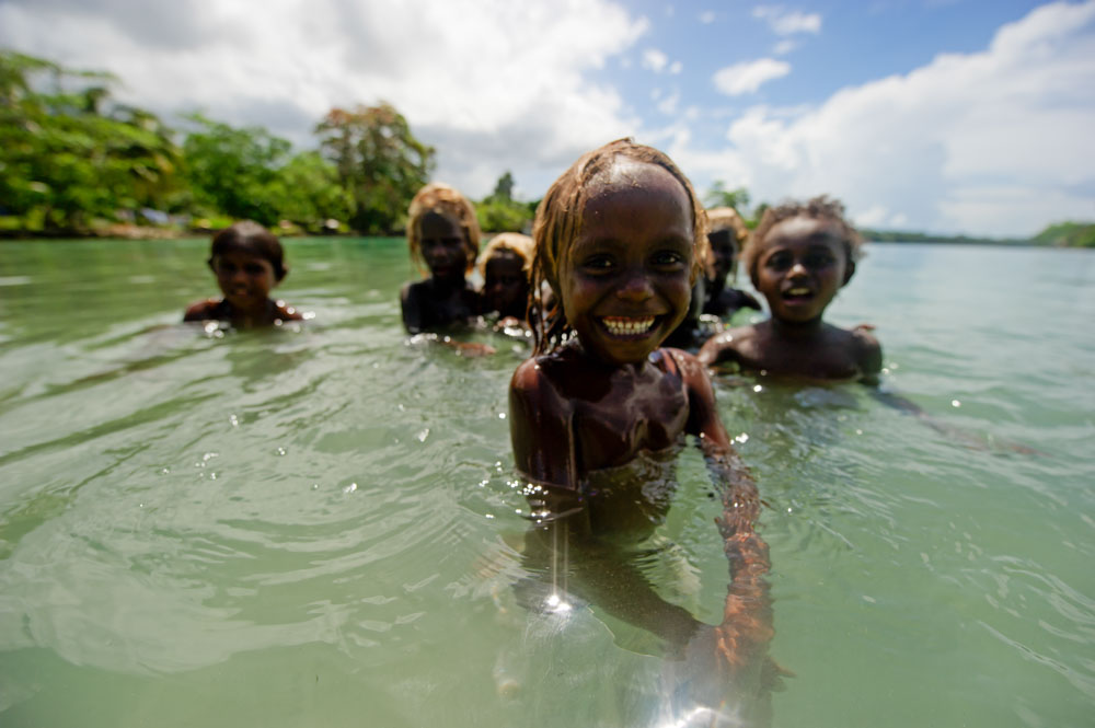 Children playing in the water in the Solomon Islands