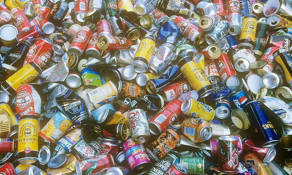 Aluminium cans at a recycling plant, UK