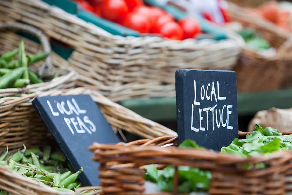 Local food (market) for sale at a shop in Cley Next the Sea, Norfolk, UK. Buying local produce helps to cut down massively on food miles.