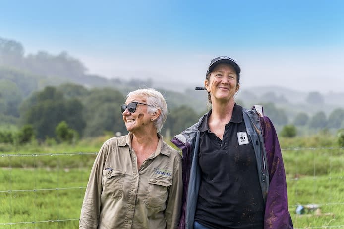 Bangalow Koalas President Linda Sparrow and WWF conservationist Tanya Pritchard embraced the mud during the tree planting event
