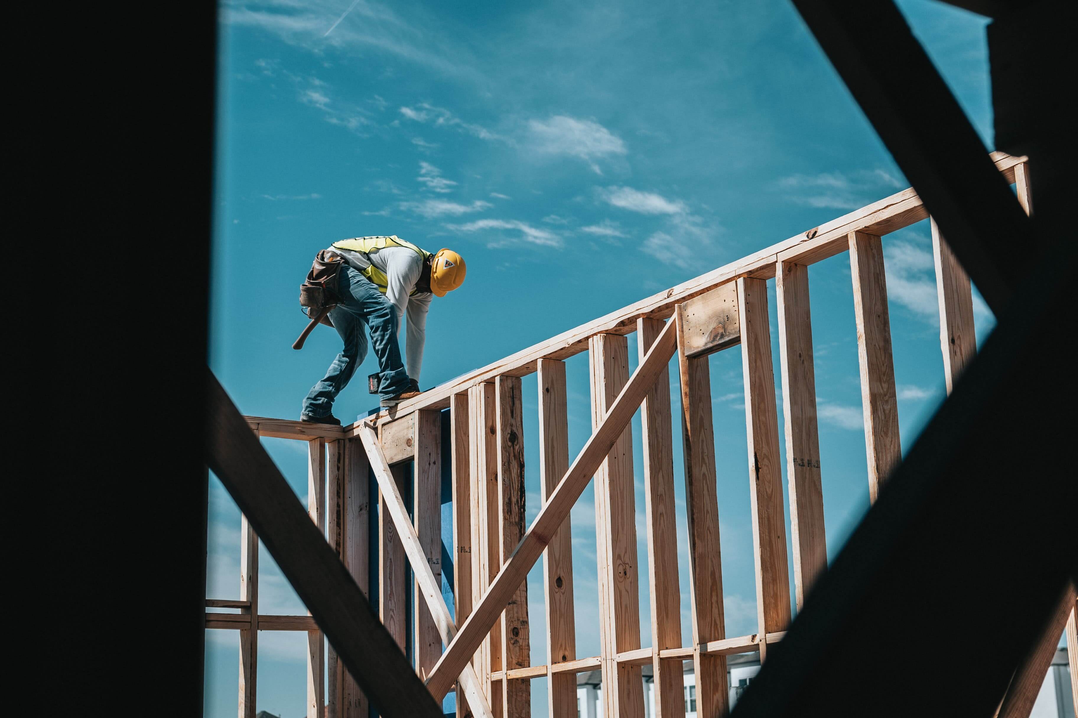 Construction worker building house