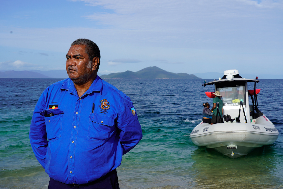 Uncle Eddie Smallwood ( Gudjuda Reference Group Aboriginal Corporation) on the beach at Brook Islands National Park= part of the Great Barrier Reef World Heritage Area